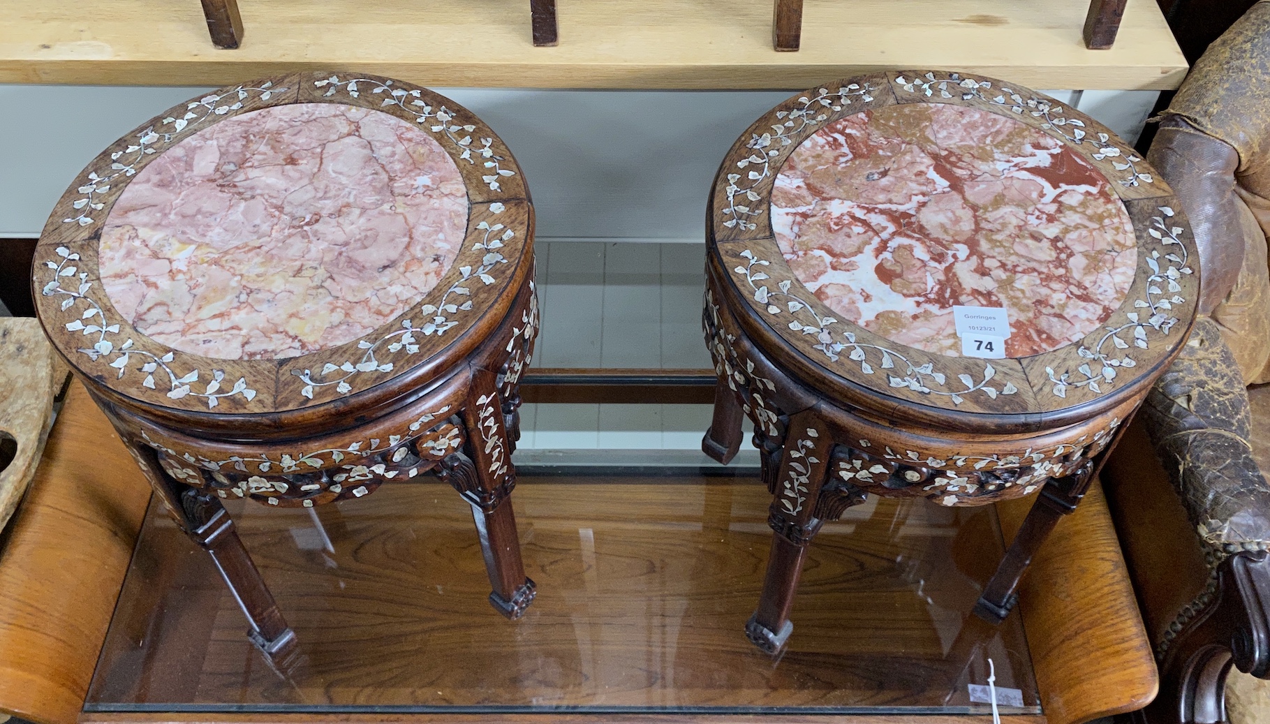 A pair of Chinese circular rouge marble topped mother of pearl inlaid hardwood jardiniere stands, diameter 40cm, height 51cm